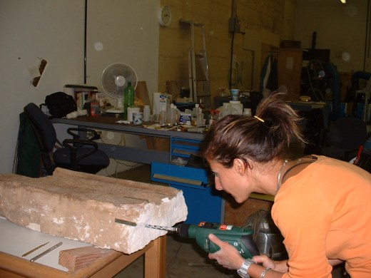Drilling holes into the limestone to place stainless steel rods